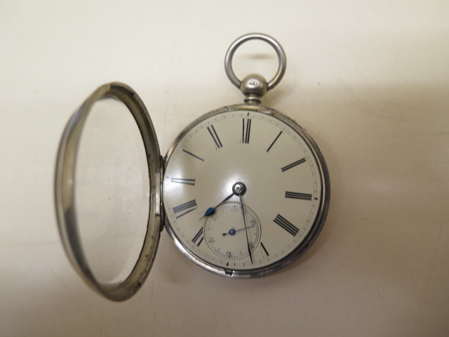 A silver pocket watch with 5.2cm case in running order, generally good some wear to case, with key - Image 2 of 4