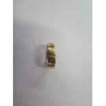 An 18ct yellow gold diamond band ring marked 750, 0.15ct, size L/M, approx 4.7 grams, in good