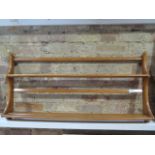 An Ercol golden elm wall shelf, 50cm tall x 97cm x 13cm