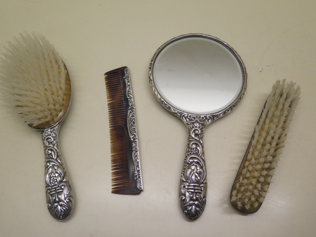 A silver embossed dressing table set, some wear and bending to comb but reasonably good - Image 2 of 2