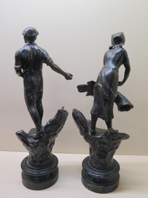 A pair of Spelter figures, 43cm tall, showing man sowing corn and lady binding corn, marked - Image 2 of 2