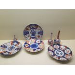 Three Imari bottle vases, tallest 16cm, and four Imari plates, all generally good, underglaze