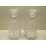 A pair of good quality cut glass decanters, 25cm tall, one has a small chip to rim and small chips