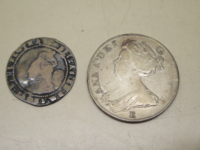 An Elizabethan sixpence piece 25mm and a 1708 half crown