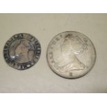 An Elizabethan sixpence piece 25mm and a 1708 half crown