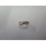 A yellow gold eleven stone diamond ring, size K, approx 3.6 grams, diamonds bright and well