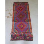 A hand knotted woollen Suzni Kilim runner, 140cm x 60cm