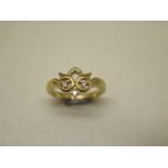 An 18ct yellow gold ladies dress ring, total weight approx 5.7 grams, incorporating three round