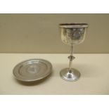 A silver communion two piece set with a weighted 8cm tall cup, hallmarked Birmingham 1882/83