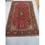 A hand knotted woollen fine Kashan rug, 2.20m x 1.35m, in good condition