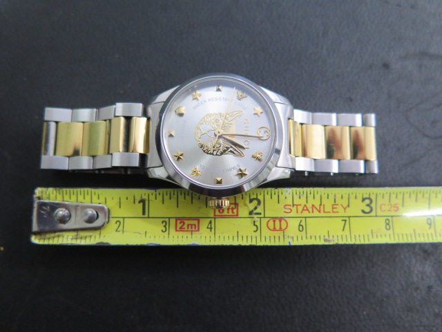 A ladies Gucci G-timeless feline two tone steel 27mm bracelet wristwatch, no box or papers but in - Image 5 of 5