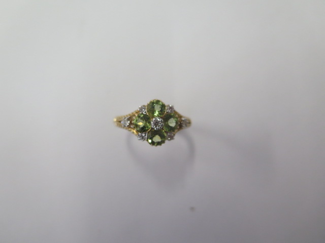 A 9ct yellow gold peridot and diamond ring, size M 1/2, hallmarked in good condition