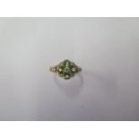 A 9ct yellow gold peridot and diamond ring, size M 1/2, hallmarked in good condition