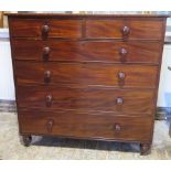 An early Victorian mahogany two over four chest of graduated drawers, the drawers with their