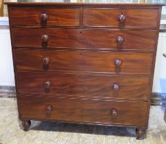 An early Victorian mahogany two over four chest of graduated drawers, the drawers with their