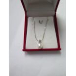 An 18ct white gold pearl pendant on an 18ct white and yellow gold 42cm chain, total weight approx