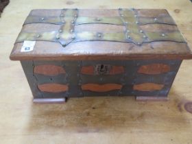 An oak brass bound box with iron carry handles, 23cm tall x 49cm x 25cm