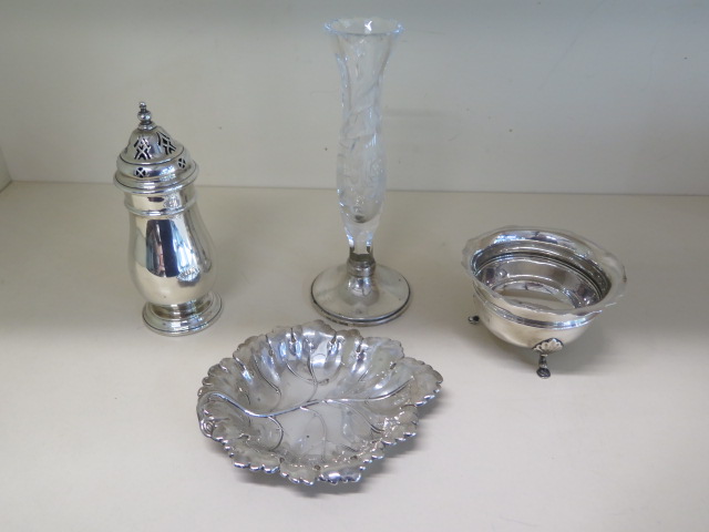 A silver leaf dish, a silver sugar bowl, a Mappin and Webb silver shaker 6cm tall and a glass vase