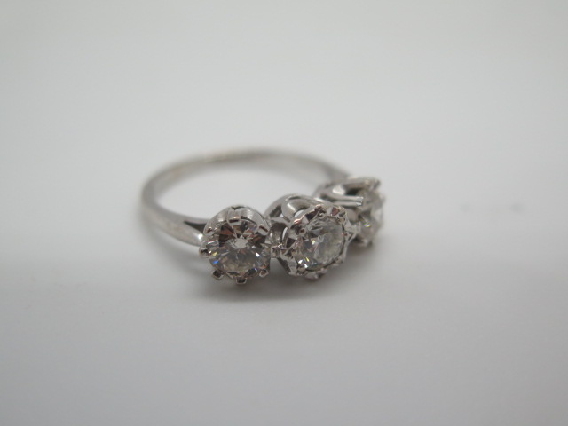 A hallmarked 18ct white gold three stone diamond ring, the outer diamonds approx 0.55ct each, the - Image 3 of 6