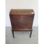 A 19th century mahogany cellarette with a dome top, 58cm tall x 40cm x 28cm, with some losses and