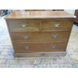 A circa 1900s Arts and Crafts scumble finish chest of two over three drawers on a plinth base,