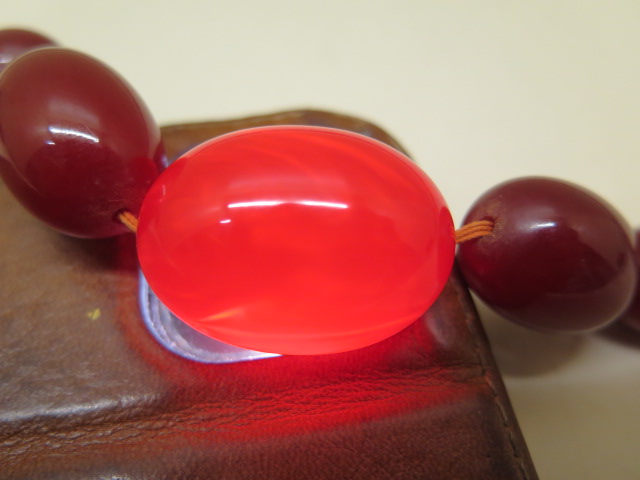 A large cherry amber type bead necklace, 72cm long, largest bead 3cm x 2.2cm, total weight approx 65 - Image 4 of 4