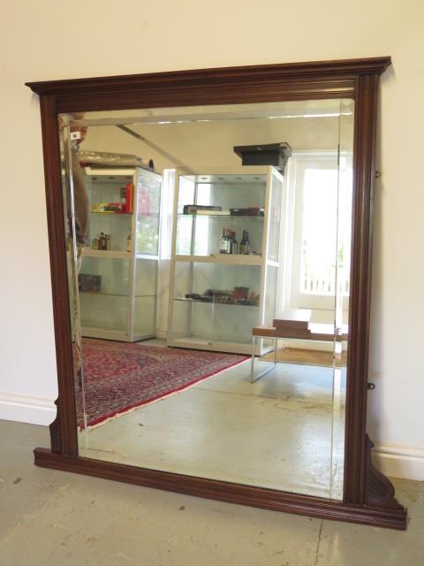 An Edwardian mahogany over mantle mirror with bevel edge glass, 138cm tall x 134cm wide