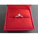 An 18ct hallmarked white gold diamond solitaire ring, approx 0.23ct, size K, in good condition,