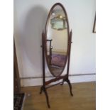 A 20th century cheval mirror in good polished condition, 160cm x 59cm