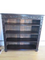 A Victorian carved oak bookcase with adjustable shelves, 115cm tall x 107cm x 30cm in good