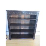 A Victorian carved oak bookcase with adjustable shelves, 115cm tall x 107cm x 30cm in good