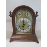 A good quality oak presentation chiming mantle clock, chiming on five gongs, movement stamped W &