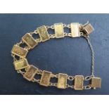 A gold bracelet set with 10 Suisse 1g 999.9 fine gold ingots, bracelet tests to approx 18ct, total