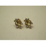 A pair of matching 18ct earrings, total weight approx 4.3 grams, fitted with threaded post and