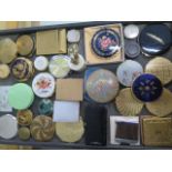 A collection of 32 compacts, a table lighter and a green plastic pot