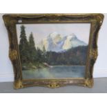 An oil on canvas Swiss Alpine scene with lake to foreground, indistinctly signed, in a gilt swept