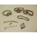 Four 9ct yellow gold ladies watches, two on 9ct sprung straps, another on a plated strap and two