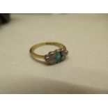 A hallmarked 18ct yellow gold and platinum emerald and diamond ring, size M/N, emerald is chipped