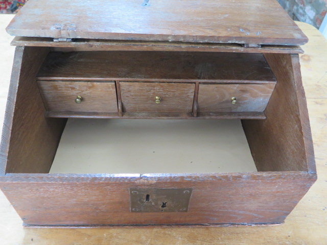 A 19th century oak clerks box with a sloping front and three internal drawers, 27cm tall x 49cm x - Image 2 of 4