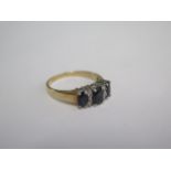 A 9ct yellow gold hallmarked sapphire ring, size K, approx 2.2 grams, in good condition