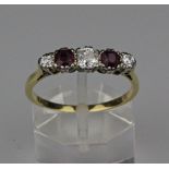 A ruby and diamond five stone ring, the claw set central old brilliant cut diamond 4.1mm x 4mm