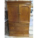 A Victorian walnut linen press with a two door top enclosing three linen slides above three long