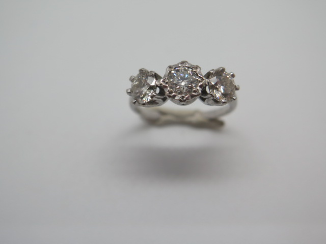 A hallmarked 18ct white gold three stone diamond ring, the outer diamonds approx 0.55ct each, the - Image 2 of 6