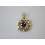 A 18ct yellow pendant, size approx 25mm x 18mm, incorporating a single round dark blue sapphire,