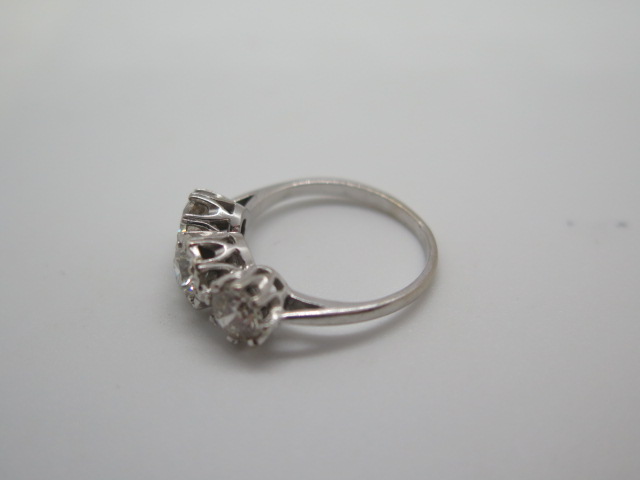 A hallmarked 18ct white gold three stone diamond ring, the outer diamonds approx 0.55ct each, the - Image 5 of 6