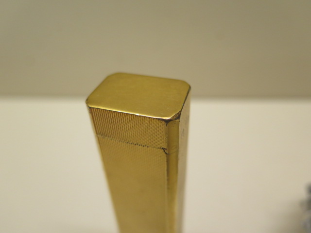 A Dunhill tallboy gold plated table lighter, 11cm tall, and two Ronson table lighters, some - Image 3 of 5