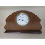 An 8 day French mantle clock mahogany case with boxwood inlay, 17cm tall, case good, running, dial