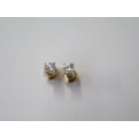 A pair of 14ct yellow gold diamond stud earrings each approx 0.30ct, with screw backs marked 14K,