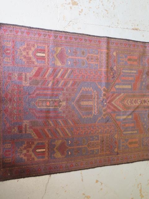 A hand knotted woollen Baluchi rug, 132cm x 86cm - Image 2 of 2