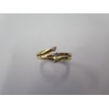 An 18ct yellow gold three stone diamond ring, size N, approx 3.7 grams